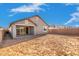 Spacious backyard featuring a covered patio and sliding glass doors at 5338 W Manzanita Dr, Glendale, AZ 85302