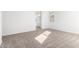 A well-lit bedroom with carpet, baseboards, and a view to the Primary bathroom at 5338 W Manzanita Dr, Glendale, AZ 85302