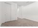 Carpeted bedroom with a closet and neutral walls at 5338 W Manzanita Dr, Glendale, AZ 85302