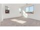 A bright bedroom with plush carpeting, three bright windows, and neutral paint at 5338 W Manzanita Dr, Glendale, AZ 85302