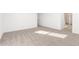 A spacious bedroom with neutral carpeting, natural light, and clean white walls at 5338 W Manzanita Dr, Glendale, AZ 85302