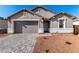 Charming single-story home with a well-maintained front yard and a two-car garage at 5338 W Manzanita Dr, Glendale, AZ 85302