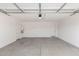Spacious garage with concrete flooring, white walls, and overhead door at 5338 W Manzanita Dr, Glendale, AZ 85302