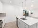 Open-concept kitchen features a sink in the island, stainless appliances, and a seamless transition to the living area at 5338 W Manzanita Dr, Glendale, AZ 85302