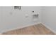 Neutral-toned laundry room featuring flooring and access points for utilities at 5338 W Manzanita Dr, Glendale, AZ 85302