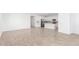 Bright, spacious living area with tile flooring, seamlessly integrating into a modern kitchen setup at 5338 W Manzanita Dr, Glendale, AZ 85302