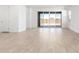 Bright, open living room with tile floors and sliding glass doors to the outside patio at 5338 W Manzanita Dr, Glendale, AZ 85302
