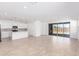 Spacious living room seamlessly connected to a modern kitchen, offering an open concept with bright light at 5338 W Manzanita Dr, Glendale, AZ 85302