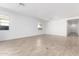 Unfurnished room with tile flooring, neutral walls, and bright, airy light offers a blank canvas for creativity at 5338 W Manzanita Dr, Glendale, AZ 85302