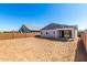 An undeveloped backyard features a covered patio at 5344 W Manzanita Dr, Glendale, AZ 85302