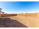 A view of a large undeveloped backyard and block wall at 5344 W Manzanita Dr, Glendale, AZ 85302