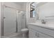 Bright bathroom features a glass shower and vanity with modern fixtures at 5344 W Manzanita Dr, Glendale, AZ 85302