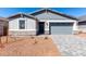 Charming single-story home featuring a grey color palette, desert landscaping, and a two-car garage at 5344 W Manzanita Dr, Glendale, AZ 85302