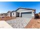 Charming single-story home featuring a gray-tone color palette and stylish stone veneer accents on the facade at 5344 W Manzanita Dr, Glendale, AZ 85302