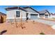 Beautiful home featuring stylish stone veneer accents, gray-tone colors, and a well-manicured front yard at 5344 W Manzanita Dr, Glendale, AZ 85302