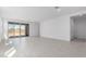 Bright and open living room with tile flooring and a sliding glass door to the outdoor area at 5344 W Manzanita Dr, Glendale, AZ 85302