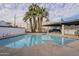 Community pool with surrounding landscaping and patio area at 6348 N 7Th Ave # 9, Phoenix, AZ 85013