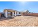 Expansive backyard with a covered patio and ample space, perfect for outdoor activities and relaxation at 5332 W Manzanita Dr, Glendale, AZ 85302