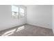 A carpeted empty room, freshly painted, awaits its purpose at 5332 W Manzanita Dr, Glendale, AZ 85302