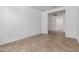 Empty bonus room with tile flooring and access to another room at 5332 W Manzanita Dr, Glendale, AZ 85302