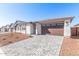 This home features a two-car garage and desert landscaping at 5332 W Manzanita Dr, Glendale, AZ 85302