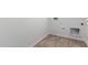This bright laundry room is ready for a washer and dryer at 5332 W Manzanita Dr, Glendale, AZ 85302