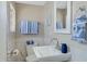 Clean bathroom with white sink, toilet and blue towels at 934 E 8Th St, Mesa, AZ 85203