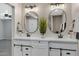 Modern bathroom with double vanity, oval mirrors, and updated fixtures at 934 E 8Th St, Mesa, AZ 85203