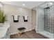 Bathroom boasts patterned shower tile, modern vanity, and wood-look floors at 934 E 8Th St, Mesa, AZ 85203