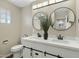 Elegant bathroom with double vanity and round mirrors at 934 E 8Th St, Mesa, AZ 85203