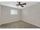 Spacious bedroom featuring a ceiling fan and window coverings at 934 E 8Th St, Mesa, AZ 85203