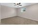 Well-lit bedroom with carpeted floors and a ceiling fan at 934 E 8Th St, Mesa, AZ 85203