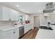 Modern kitchen with white cabinets, quartz countertops, and stainless steel appliances at 934 E 8Th St, Mesa, AZ 85203
