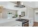 Modern kitchen with white cabinets and stainless steel appliances at 934 E 8Th St, Mesa, AZ 85203