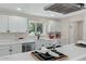 Modern kitchen island with quartz countertops and breakfast bar at 934 E 8Th St, Mesa, AZ 85203