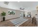 Living room features hardwood floors, sliding glass doors to backyard, and a ceiling fan at 934 E 8Th St, Mesa, AZ 85203