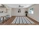 Spacious living room with hardwood floors, ceiling fan, and a large area rug at 934 E 8Th St, Mesa, AZ 85203