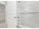Clean and bright bathroom featuring a tiled tub and shower at 12322 W Marguerite Ave, Avondale, AZ 85323