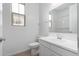 Bathroom featuring white vanity with sink, a toilet, and a window at 12322 W Marguerite Ave, Avondale, AZ 85323