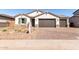 Beautiful single-story home showcasing a three-car garage and charming curb appeal at 12322 W Marguerite Ave, Avondale, AZ 85323