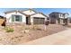 Charming single-story home featuring a well-manicured yard and a spacious two-car garage at 12322 W Marguerite Ave, Avondale, AZ 85323
