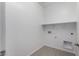 Dedicated laundry room with washer/dryer hookups and tile flooring at 12322 W Marguerite Ave, Avondale, AZ 85323
