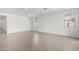 Open living room with tile flooring, recessed lighting, and natural light at 12322 W Marguerite Ave, Avondale, AZ 85323