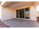 Covered patio featuring concrete flooring and sliding glass doors leading to the interior at 12322 W Marguerite Ave, Avondale, AZ 85323