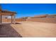 Spacious backyard featuring a covered patio and block wall, perfect for outdoor entertaining at 12326 W Marguerite Ave, Avondale, AZ 85323