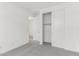 A carpeted bedroom leads to the walk-in closet with sliding doors and a bathroom at 12326 W Marguerite Ave, Avondale, AZ 85323