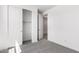 A carpeted bedroom leads to the walk-in closet with sliding doors and a bathroom at 12326 W Marguerite Ave, Avondale, AZ 85323
