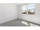 A carpeted bedroom features a double window that lets in natural light at 12326 W Marguerite Ave, Avondale, AZ 85323