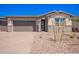 Charming single-story home with a desert-landscaped front yard and a two-car garage, perfect for modern living at 12326 W Marguerite Ave, Avondale, AZ 85323