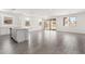 Spacious living area with tile flooring, seamlessly connecting to the kitchen and dining areas at 12326 W Marguerite Ave, Avondale, AZ 85323